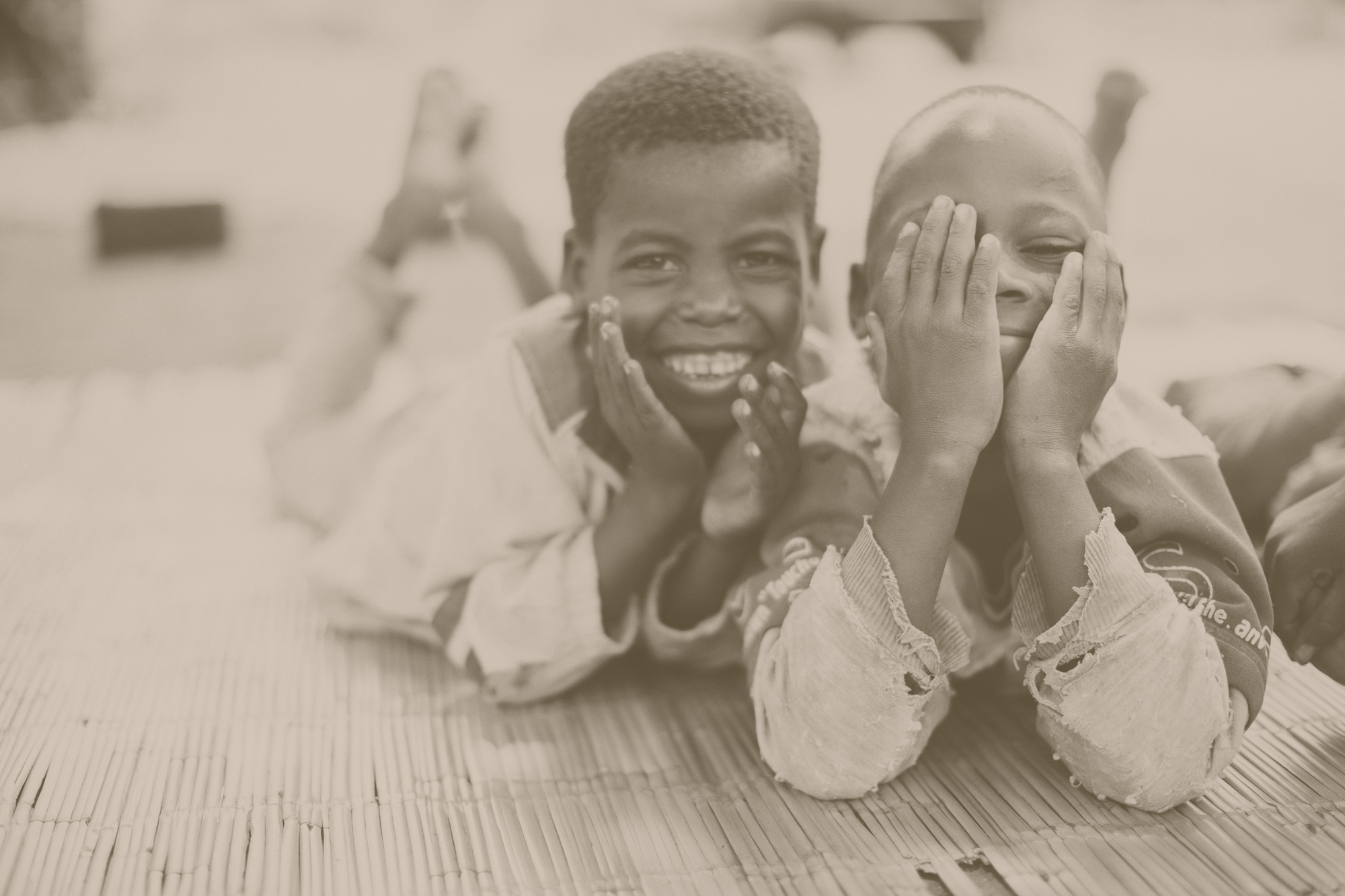 Smiling children laugh together.