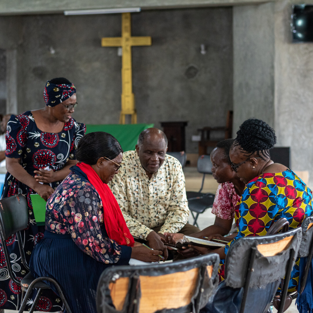 Bible study participants sit together