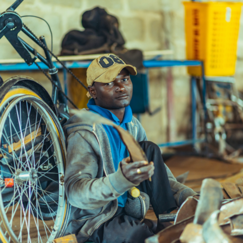 A man building a wheelchair.
