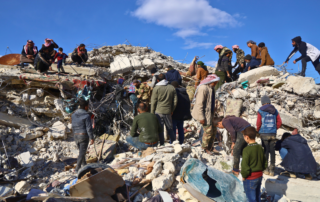 Families dig through the rubble in Syria.