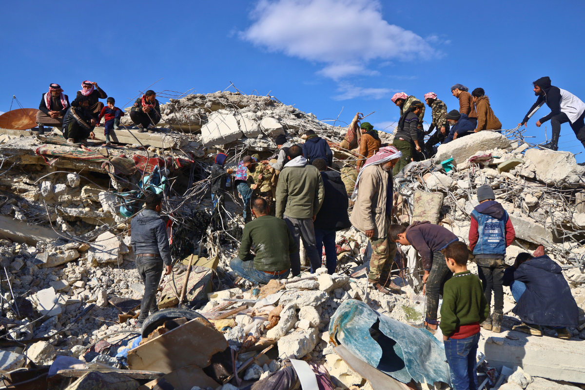 Families dig through the rubble in Syria.