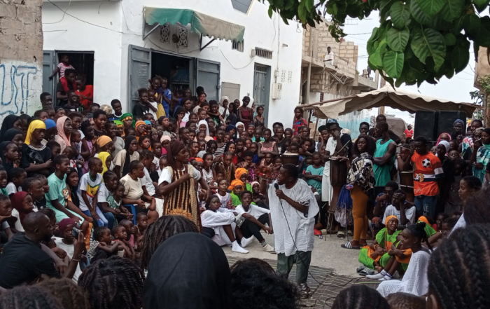 A group gathered to listen to a street speaker