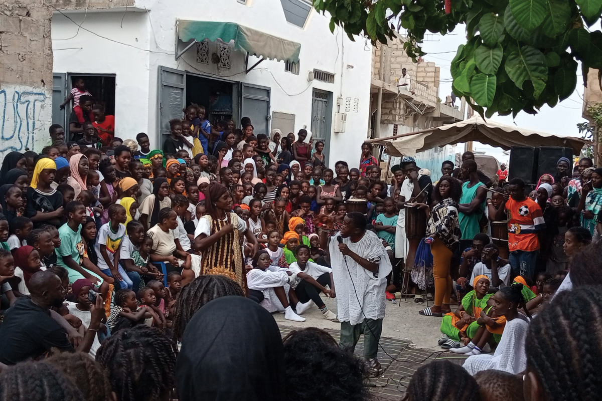 A group gathered to listen to a street speaker