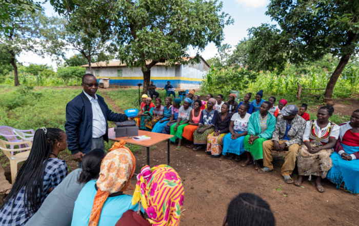 A leader addresses a village savings and loan association
