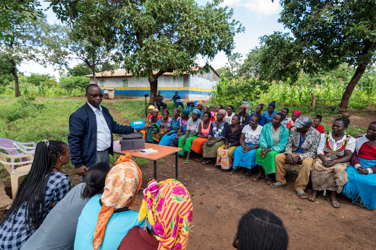 A leader addresses a village savings and loan association