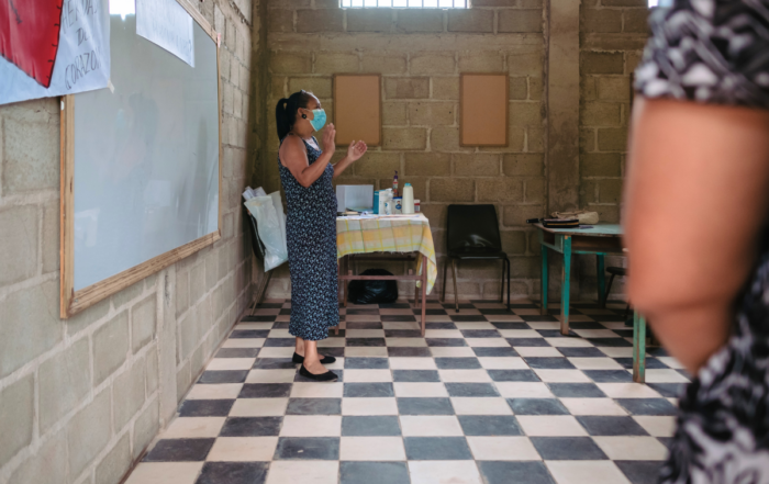 A woman leading a healing session