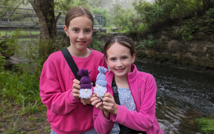 Jessica and Brooke holding their gnomes