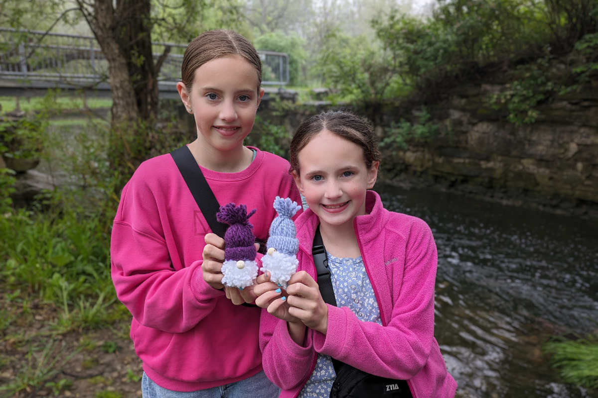 Jessica and Brooke holding their gnomes