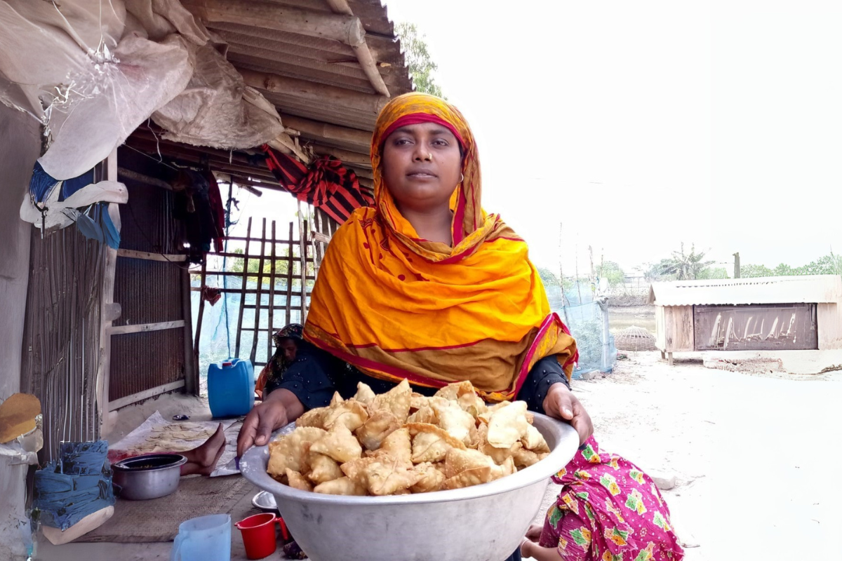 A woman with snacks she sells at market