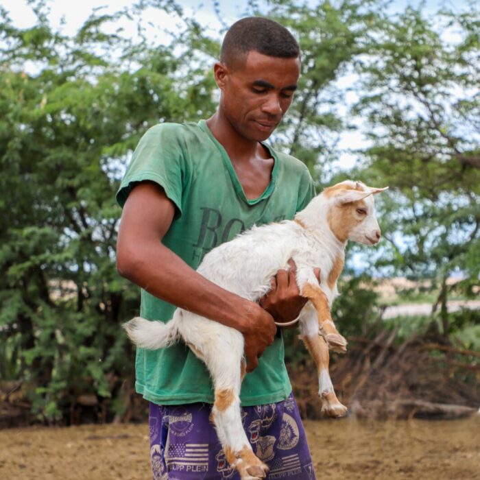 man holding goat