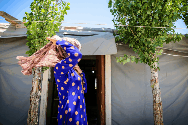 Mother holds her child in a corn field