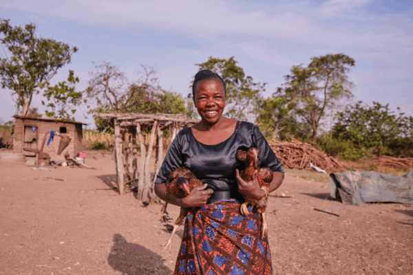 A woman holds chicken