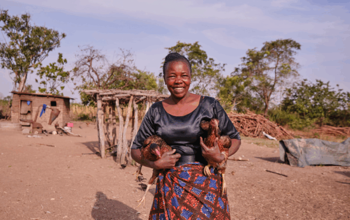 A woman holds chicken