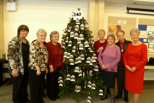 Mother holds her child in a corn field