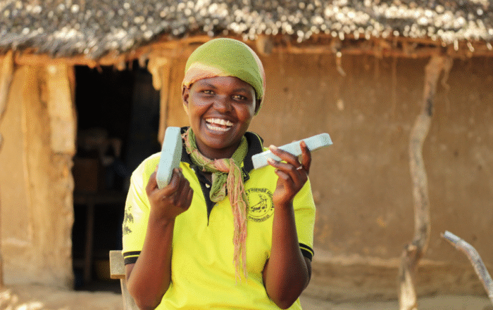 A woman holds soap