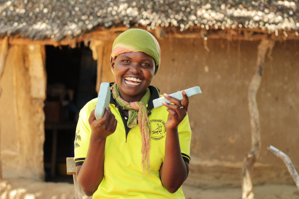 Mother holds her child in a corn field