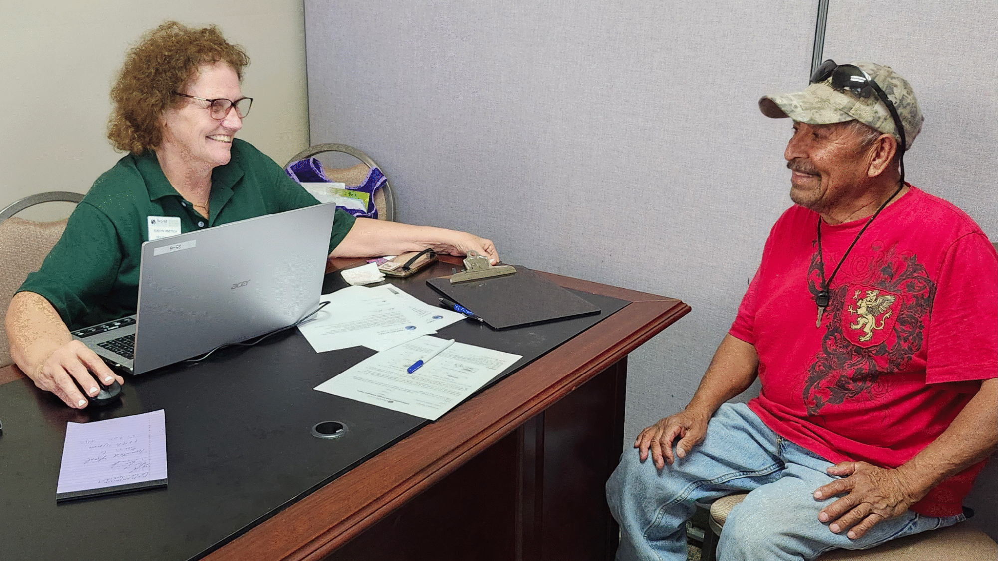 Woman interviews flood survivor