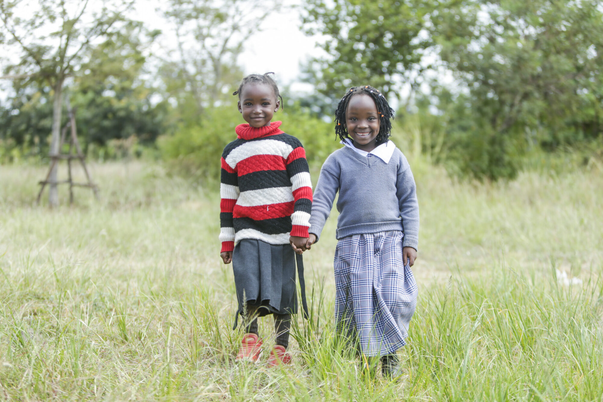 Smiling children laugh together.